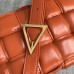 Bottega Veneta Padded Cassette Bag In Orange Calfskin